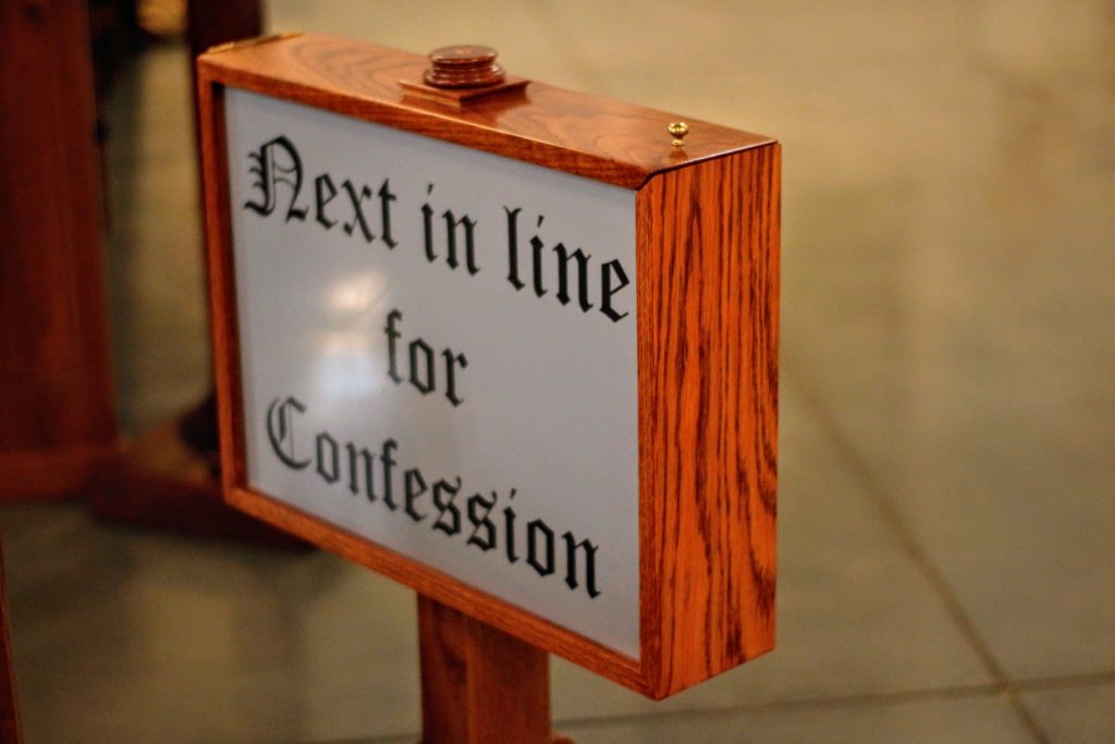 sign denoting next in line for confession